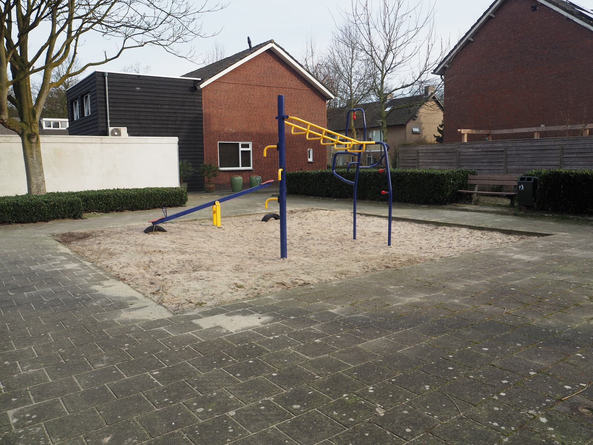 Enlarge image: a seesaw with a climbing frame in front of it.