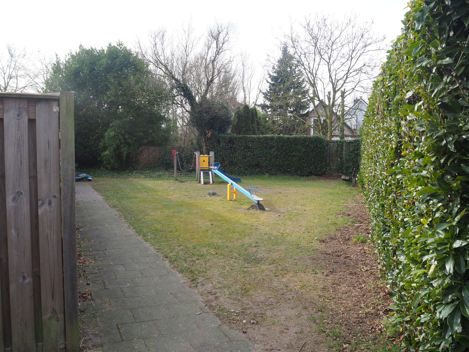 Enlarge image: a seesaw with a climbing frame with slide behind it